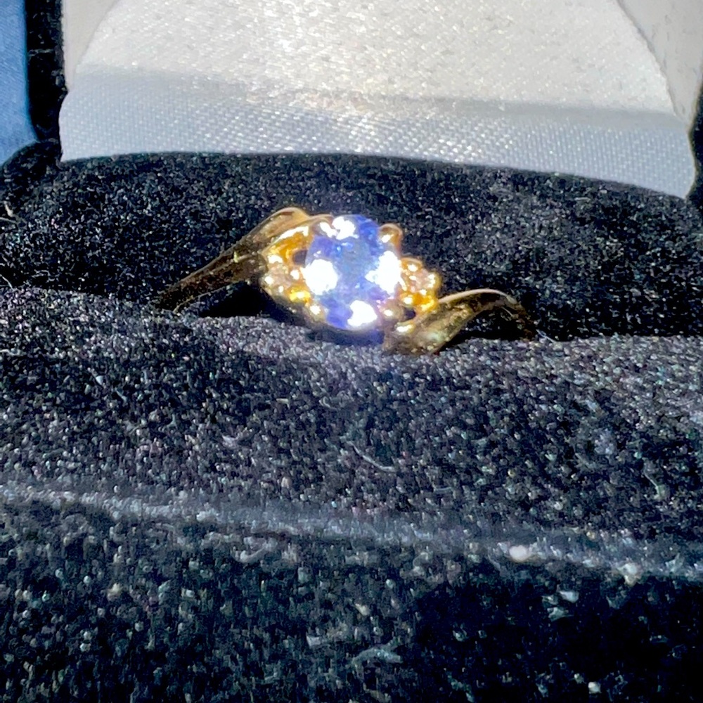 14k gold tanzanite ring with two small diamonds.  Made in Canada